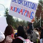 A Federal Way High School student holds a sign stating that deportation without due process is called kidnapping during a student-planned walk out on Feb. 5. Photo by Keelin Everly-Lang / the Mirror