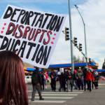 A student holds a sign that reads deportation disrupts education during a student-led protest that began at Federal Way High School. Photo by Keelin Everly-Lang / the Mirror.