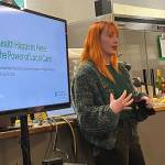 Reporter Keelin Everly-Lang for the Federal Way Mirror introduces the guest speaker at the Hot off the Presses event Feb. 11 at Poverty Bay Cafe. Staff photo