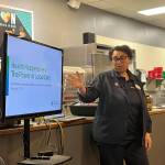 Guest speaker Cynthia Ricks-Maccotan shares a presentation at the Federal Way Mirrors Hot off the Presses event on Feb. 11. Staff photo