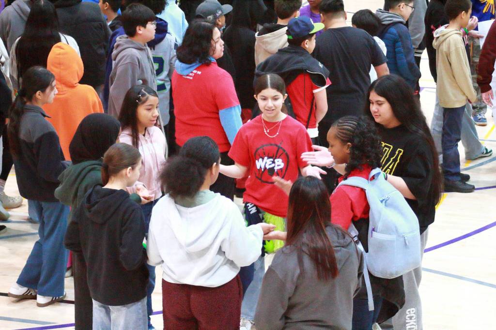 Students play clapping games and participate in other activities to build a sense of belonging at No One Eats Alone Day.