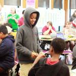 Students complete bingo sheets to learn more about each other at the No One Eats Alone lunchtime activity at Illahee Middle School. Photo by Keelin Everly-Lang / the Mirror