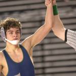 Todd Beamer High Schools Caleb Clemans has his hand raised as he wins his semifinal match. Ben Ray / The Mirror