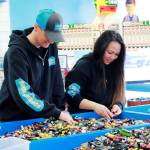 Six tables of loose Lego pieces can be bought by bucket, or a smaller container if you prefer. Here owners Matt and Charity Morningstar search for a unique piece for a customer.
