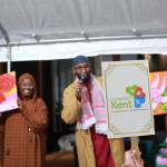 An attendee bids on paintings done by youth in the community to raise money for the House of Dua.