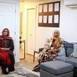 Guests celebrating the opening of the House of Du'a gather in the living room of the new faith-centered culturally responsive housing for women. Photo by Keelin Everly-Lang / the Mirror