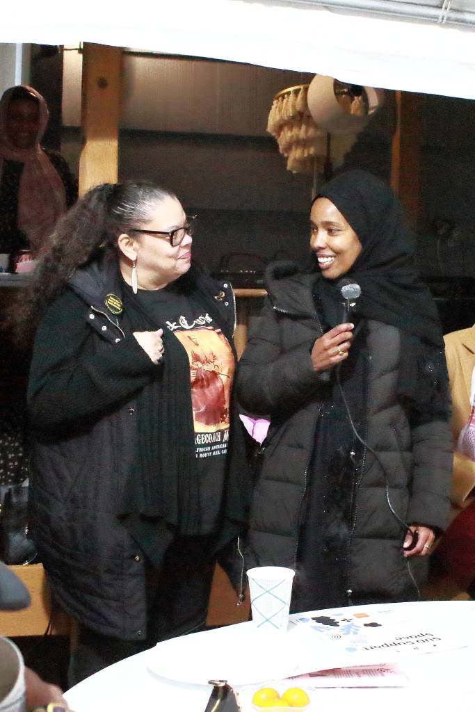 Women in recovery celebrate each other at the House of Du'a opening event. Photo by Keelin Everly-Lang / the Mirror