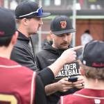 Thomas Jefferson assistant coaches prepare their side before scrimmage. Ben Ray / The Reporter