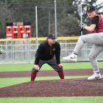 Current Thomas Jefferson High School head coach Harold Adams gets ready to call balls and strikes during a scrimmage. Ben Ray / The Reporter