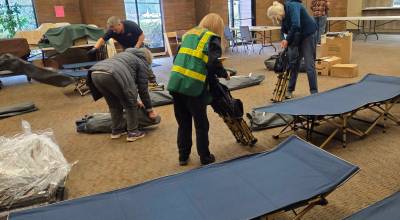 PhotoS courtesy of Sharon Green 
Volunteer members of the Greater Federal Way Community Emergency Response Team (GFW CERT) set up cots at the Calvary Lutheran Church in Federal Way for emergency shelter in February 2026.