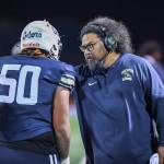 Head Coach Matt Vaeena embraces a player. Photo provided by Dee Torres