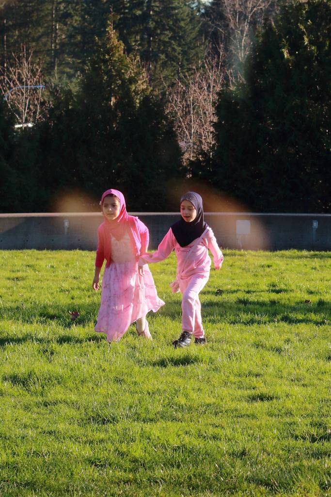 Two girls play outside during a fundraiser luncheon at the Federal Way Community Center. Photo by Keelin Everly-Lang / the Mirror