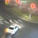 Two children cross the street right before being hit by the white car on Jan. 21, 2026, at the intersection of 19th Avenue SW and SW Campus Drive. Photo from SafeCity footage