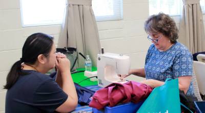 Volunteers mend and hem clothing at the Federal Way Repair Cafe on March 28 at the South King Tool Library. Photo by Keelin Everly-Lang / the Mirror
