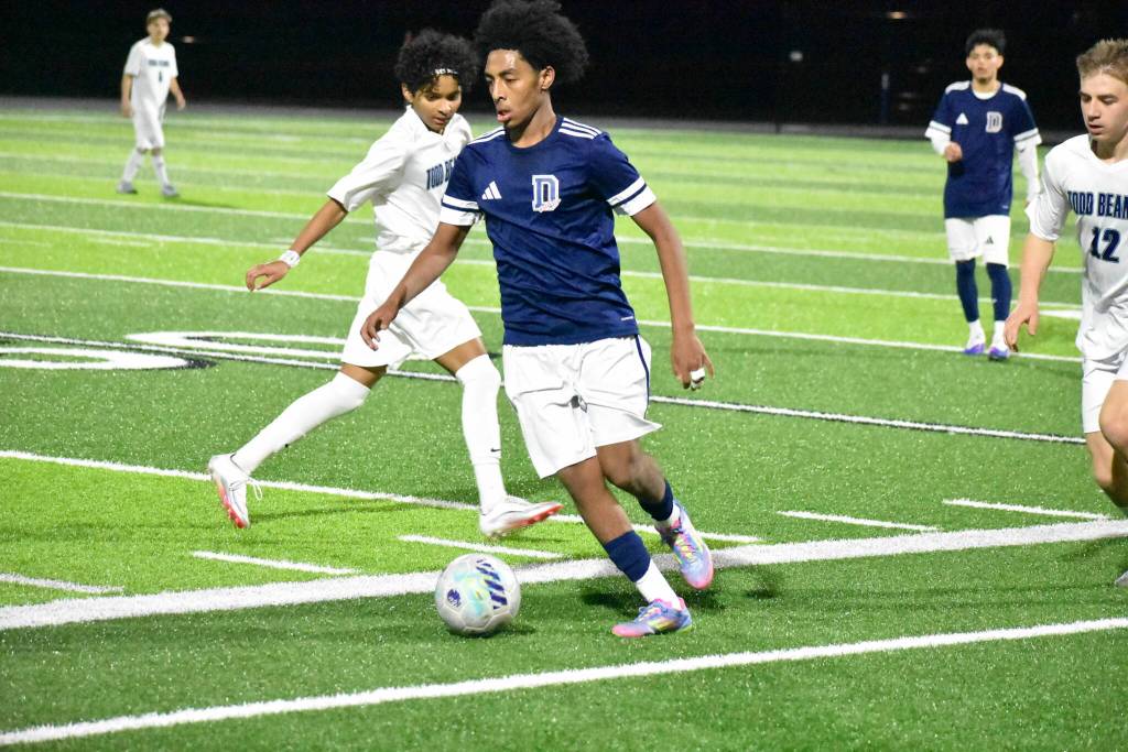 Decatur soccer player kicks the ball back to a teammate. Ben Ray / The Mirror