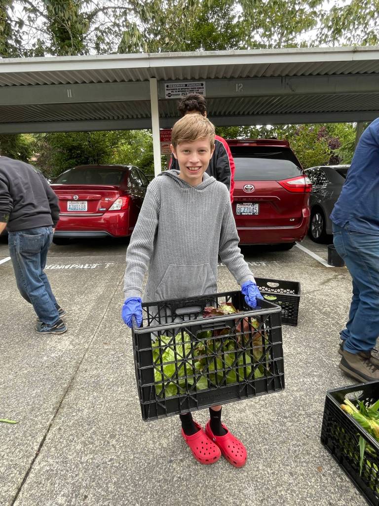 Volunteer and Martha Collins grandson. Photo courtesy of Martha Collins
