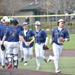 Decatur high-five line after win over Peninsula. Ben Ray / The Mirror