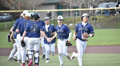 Decatur high-five line after win over Peninsula. Ben Ray / The Mirror