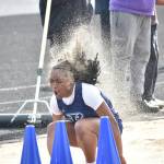 Todd Beamer long jumper rolls in the sand after somersaulting in the pit. Ben Ray / The Mirror