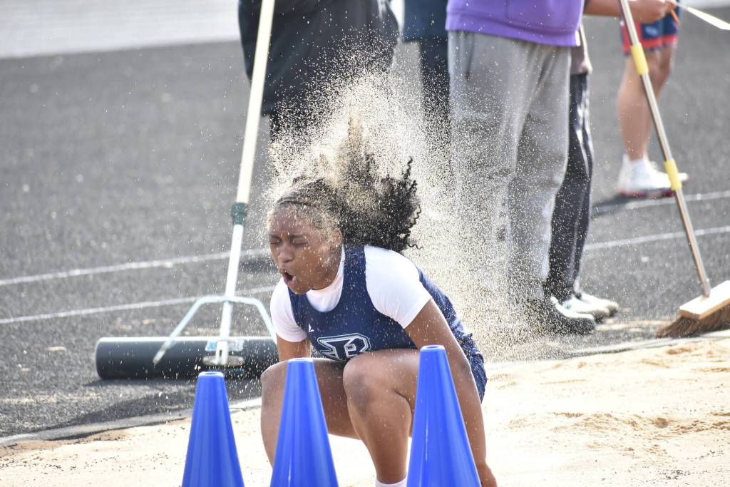Todd Beamer long jumper rolls in the sand after somersaulting in the pit. Ben Ray / The Mirror