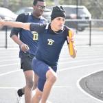Decaturs A relay team hands the baton to the anchor leg. Ben Ray / The Mirror
