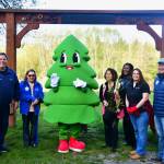 Photo by Bruce Honda
Mayor Jim Ferrell, Council President Susan Honda, community leader Shelley Pauls, Councilmember Lydia Assefa-Dawson and Councilmember Jack Walsh pose with the citys Parks and Recreation mascot, Dougie Fir, on Parks Appreciation Day.