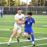Josh Ruiz-Perez fights with Dylan Berdan of White River for the ball. Ben Ray / The Reporter