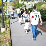 Families walk down the ramp between food trucks near the civic plaza down to the market vendors on S. 316th Street. Photo by Keelin Everly-Lang / the Mirror
