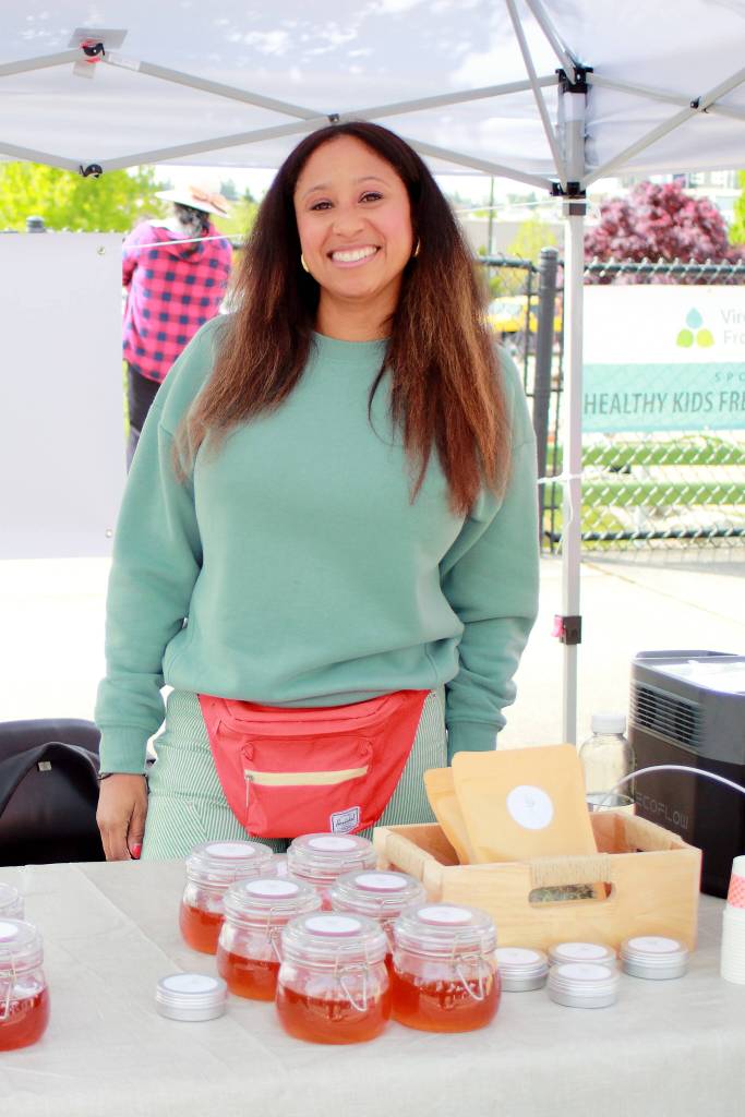 Erica Pulley of Es Apothecary selling infused honey, teas and more at the Federal Way Farmers Market. Photo by Keelin Everly-Lang / the Mirror