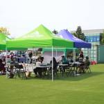 The new civic plaza turf field held a few covered areas for visitors to enjoy their treats from food vendors next to the PAEC. Photo by Keelin Everly-Lang / the Mirror