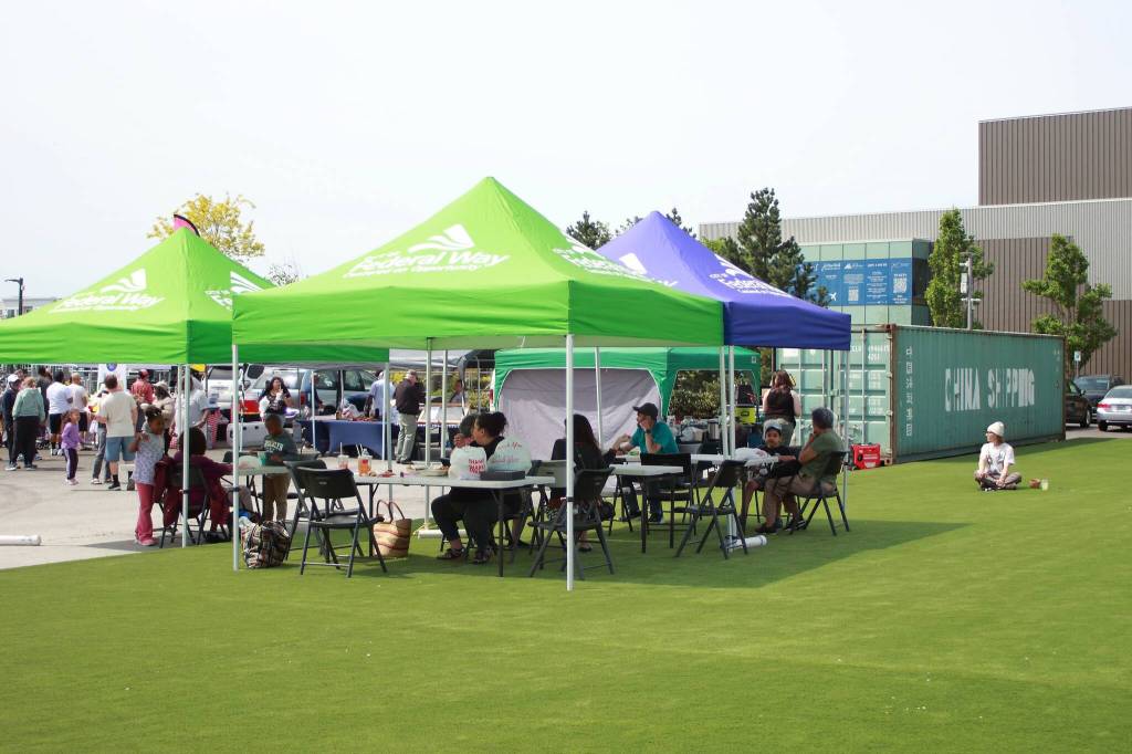 The new civic plaza turf field held a few covered areas for visitors to enjoy their treats from food vendors next to the PAEC. Photo by Keelin Everly-Lang / the Mirror