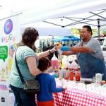 A food vendor on the upper level of the Federal Way Farmers Market on opening day. Photo by Keelin Everly-Lang / the Mirror