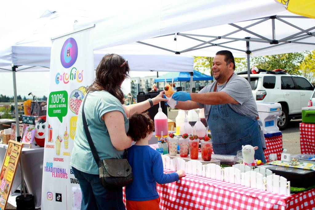 A food vendor on the upper level of the Federal Way Farmers Market on opening day. Photo by Keelin Everly-Lang / the Mirror