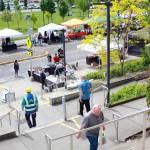 Federal Way community members travel between the two levels of the Federal Way Farmers Market on opening day. Photo by Keelin Everly-Lang / the Mirror