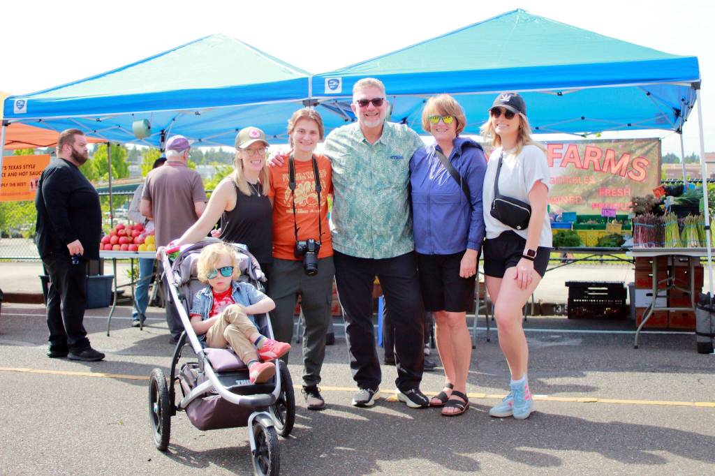 Federal Way city parks staff and family members enjoy the opening day of the Federal Way Farmers Market. Photo by Keelin Everly-Lang / the Mirror