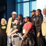 Students pose with speakers at the end of the SYSC conference. Photo by Keelin Everly-Lang / the Mirror.