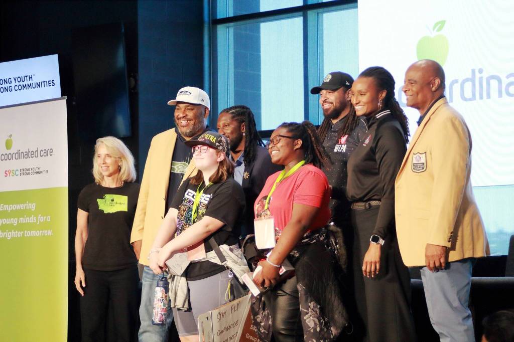 Students pose with speakers at the end of the SYSC conference. Photo by Keelin Everly-Lang / the Mirror.