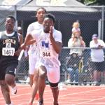 Zamarie Tellez runs the second leg of the 4 X 100 relay. Ben Ray / Sound Publishing