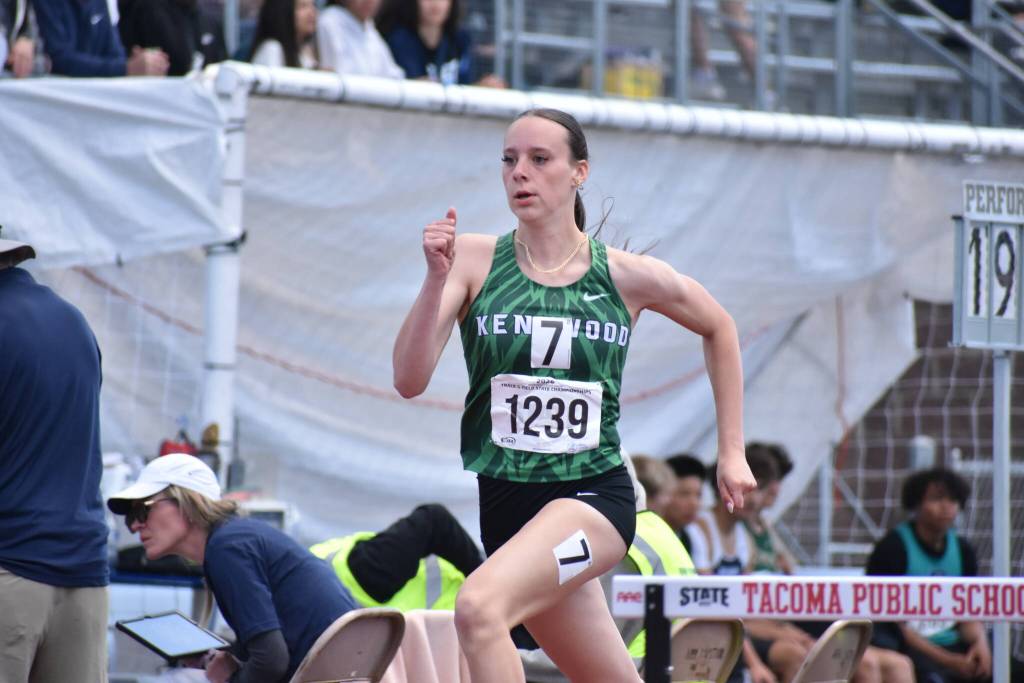 Maddie Hughes runs in the 300 Hurdle race for Kentwood. Ben Ray / Sound Publishing
