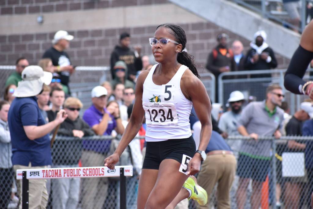 Chloe Williams of Kentridge runs in the 300 hurdle race. Ben Ray / Sound Publishing