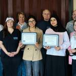 Scholarship recipients Dianna Favela Lopez and Aisha Ahsari are pictured holding their certificates. Also pictured (from left) is Kiwanis Scholarship Chair Karen Brugato, TJHS Key Club Advisor Melissa Hamilton, Joyce Hulse, Todd Beamer Key Club Advisor Dick Hayek, Kiwanis President and Decatur Key Club Advisor Michael Brugato and Federal Way High School Key Club Advisor Susan Honda.