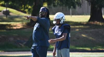 Evan Cook points during Decatur practice during a walk through portion of practice. Ben Ray / The Mirror