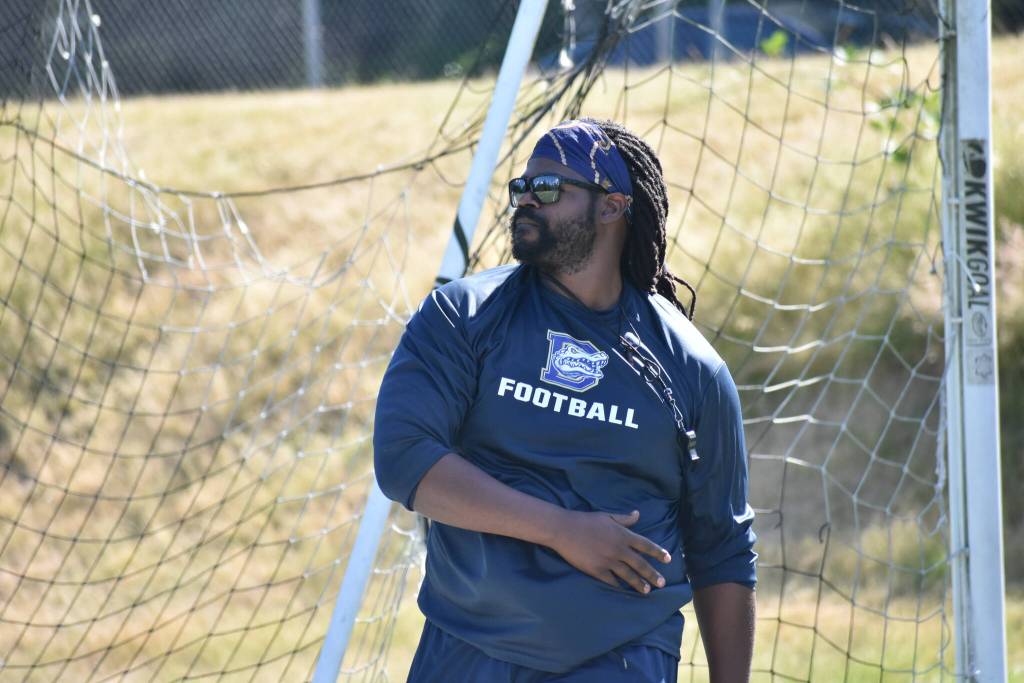 Evan Cook finishes a pass during a drill for Decatur as new head coach. Ben Ray / The Mirror