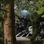 Photo by Allyson Ballard. A portion of a neighboring home still smoldered on Thursday.
