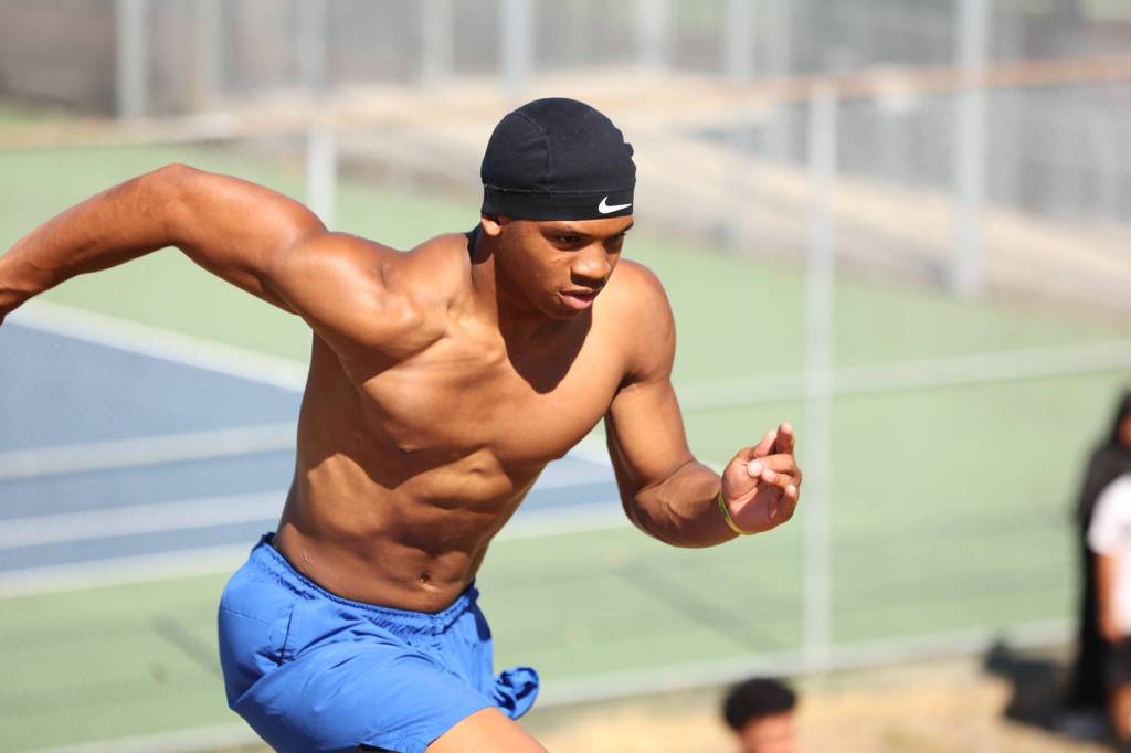 Kaicen Carter runs up a hill for Federal Way. Ben Ray / The Mirror