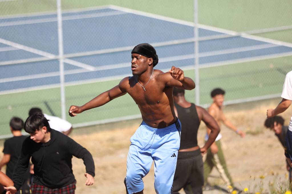 Ryan Kahulu shuffles up the hill during conditioning for Federal Way. Ben Ray / The Mirror