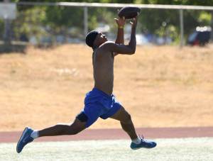 Kaicen Carter leaps to catch a pass. Ben Ray / The Mirror