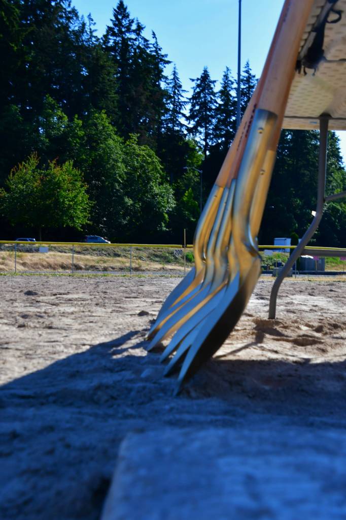 Gold shovels before they get used to break ground on new turf fields.