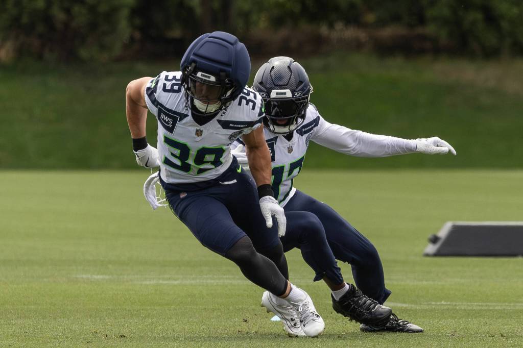 Two defensive backs; Ty Okada and Noah Igbinoghene participate in a drill. Photo provided by Maria Dorsten