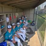 Soundview Little League players sit in the dugout during the state tournament. Photo provided by Mark Landry.